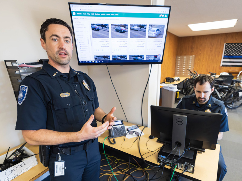 UMMC Deputy Chief of Police Joshua Bromen, left, and Captain Nick Kehoe demonstrate advanced software associated with new solar-powered security cameras installed across campus.
