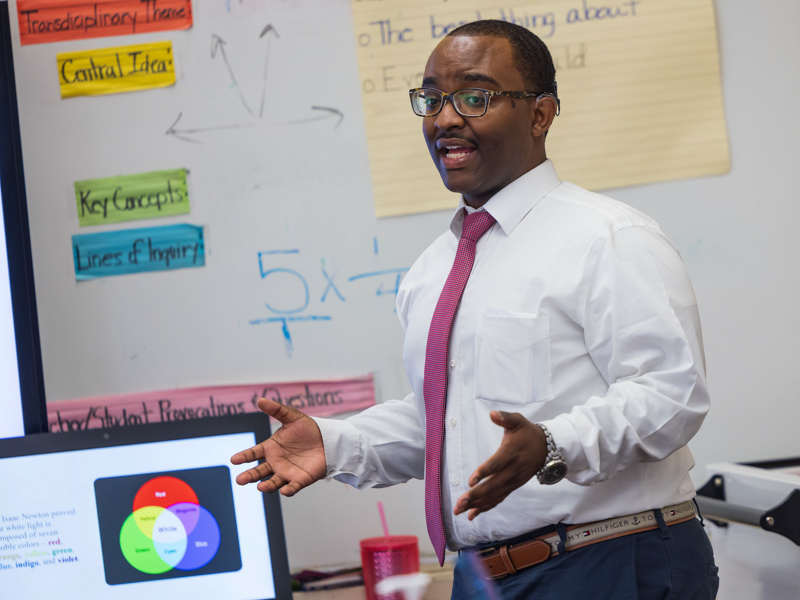 Joe Mack teaches a lesson on light to 4th graders at Barack H. Obama Magnet Elementary School in downtown Jackson.