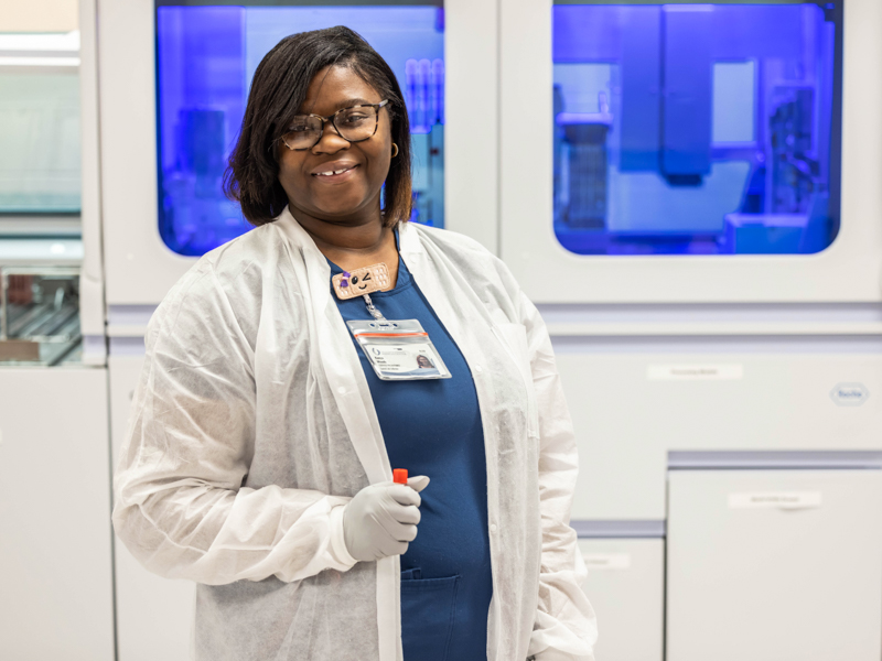 Kenya Woods prepares for her shift in the phlebotomy lab. Melanie Thortis/ UMMC Communications