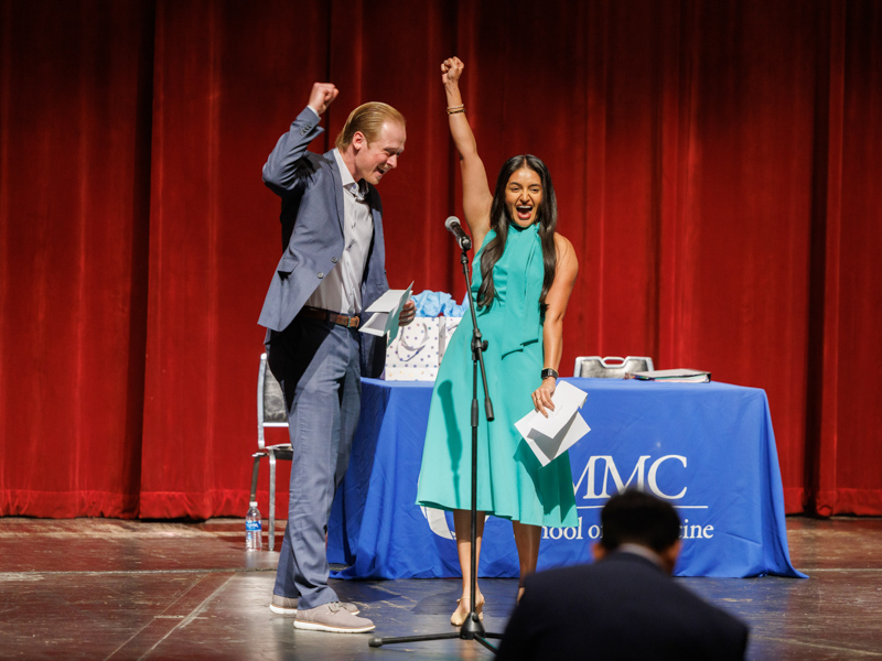 Punching the air for joy, Matthew Pinto and Ruhi Randhawa announce their couples match at UMMC in emergency medicine and anesthesiology, respectively, on Match Day in March. Joe Ellis/ UMMC Communications 