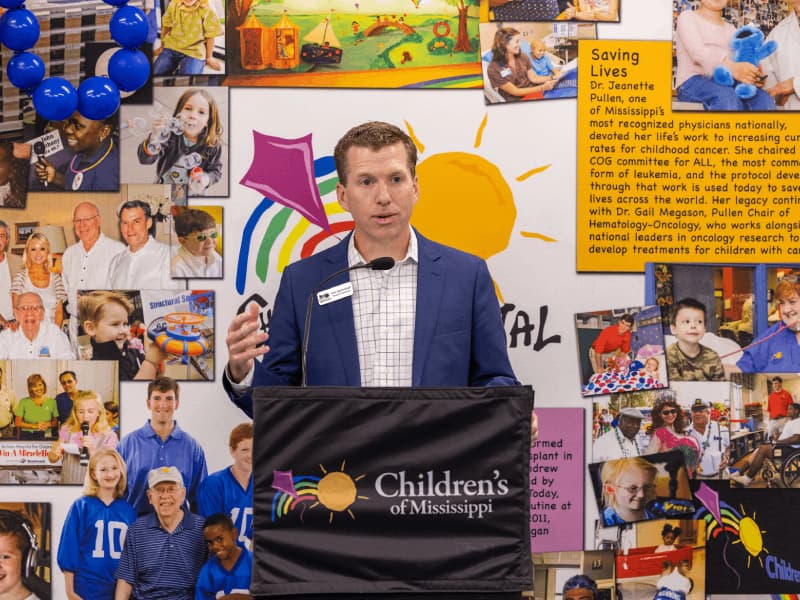 John Scarbrough, board chairman of Friends of Children's Hospital, shares stories of Sidney Allen's leadership during a presentation May 17.