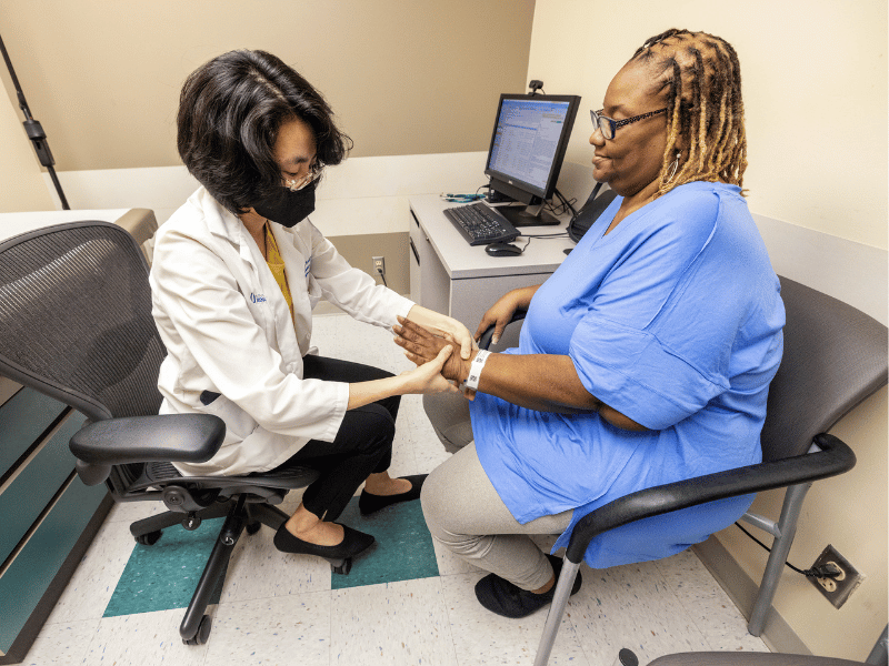 During a recent appointment with rheumatologist, Dr. Cathy Lee Ching, sarcoidosis patient Debora Delaney-Norris receives, and delivers, good news about her progress.