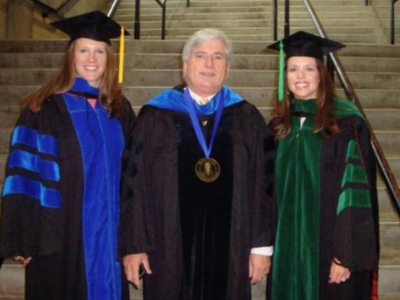 Dr. Joey Granger is flanked by Murphy, left, and sister Lyndsay Shipp, who both graduated in 2010 from UMMC.