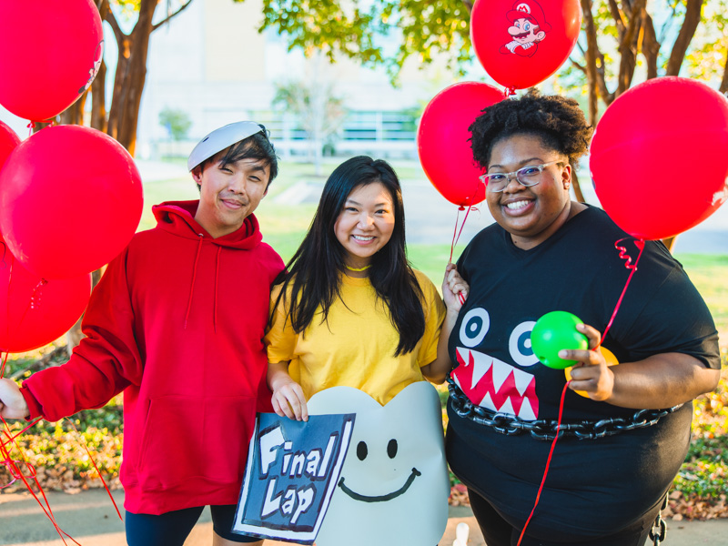 Pharmacy students Wes Ngo, Jenny Liu, and Victoria Green enjoy Spooky U.