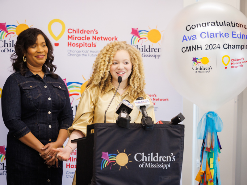 Ava Clarke Edney, with her mom, Shala Edney, by her side, speaks during her announcement as the state's 2024 Children's Miracle Network Hospitals Champion.