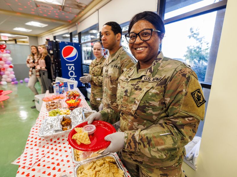 Sgt. Paula Jobe and fellow Mississippi National Guard members brightened Valentine's Day at Children's of Mississippi by hosting brunch for hospital inpatients. Jay Ferchaud/ UMMC Photography 