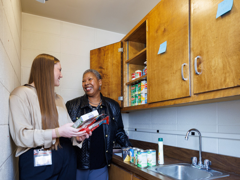 Nursing student Katelynn Gipson and Dr. Marilyn Harrington take inventory in the School of Nursing's food pantry.