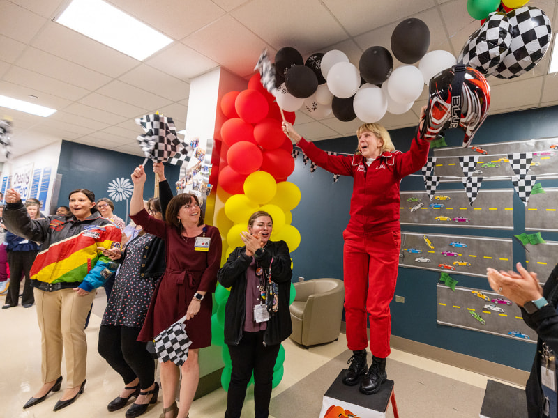 Patient Safety Week committee members, from left, Dr. Lisa Didion, Kim Barrier, Heather Wise and Johnnie Sue Wijewardane take part in a cheer led by Dr. Phyllis Bishop at the end of the 2023 Patient Safety Week.