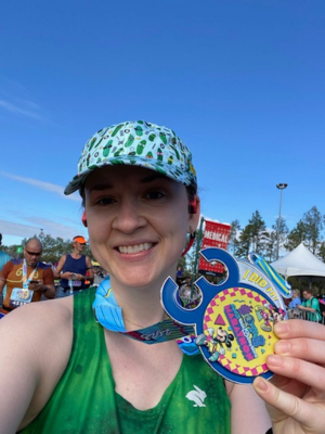 Dr. Allison Strickland pictured with her medal from the 2023 Walt Disney World Marathon.