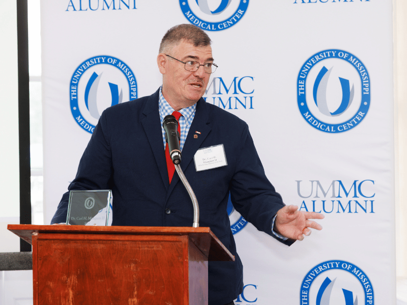 Dr. Carl Mangum expresses gratitude to colleagues and family after receiving the 2024 Alumnus of the Year Award.