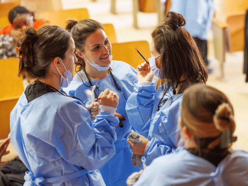 Kelsey Welch, dental hygiene instructor; Brittany Rogel, assistant professor of dental hygiene; and Reagan Spengler, dental hygiene instructor prepare to give oral exams at South Delta Middle School.