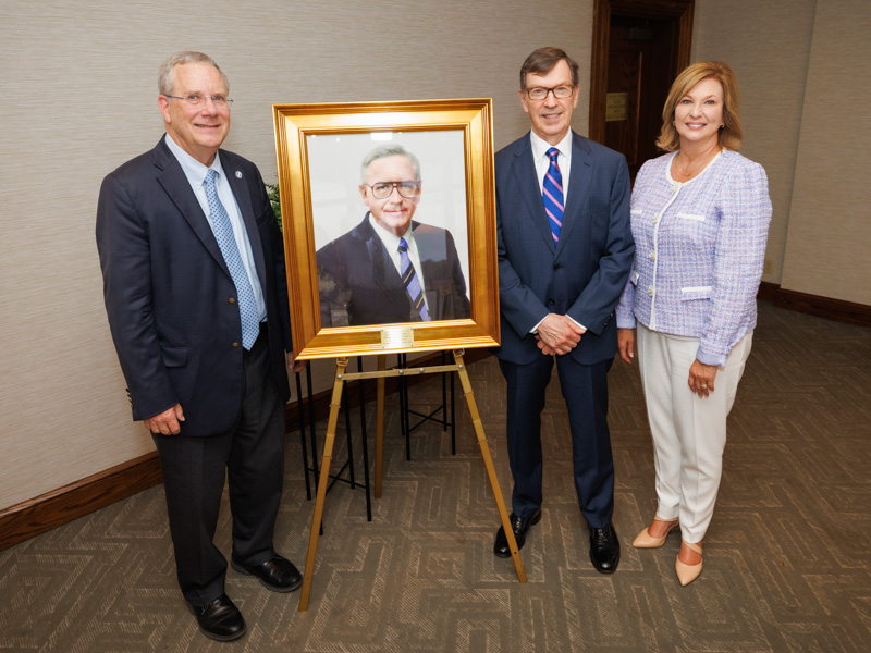Dr. Robert Brodell, chair of the Department of Pathology, Dr. Robert Lewis, professor emeritus, and Dr. Louann Woodward, vice chancellor for health affairs, honor Dr. Julius Cruse at the chair endowment ceremony.