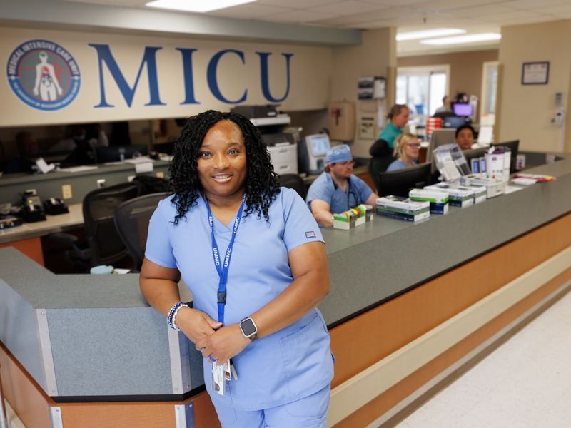 As a unit secretary, Nechole Sullivan fills multiple roles in preparing nursing staff for patient care in the Medical Intensive Care Unit (MICU). Jay Ferchaud/ UMMC Communications