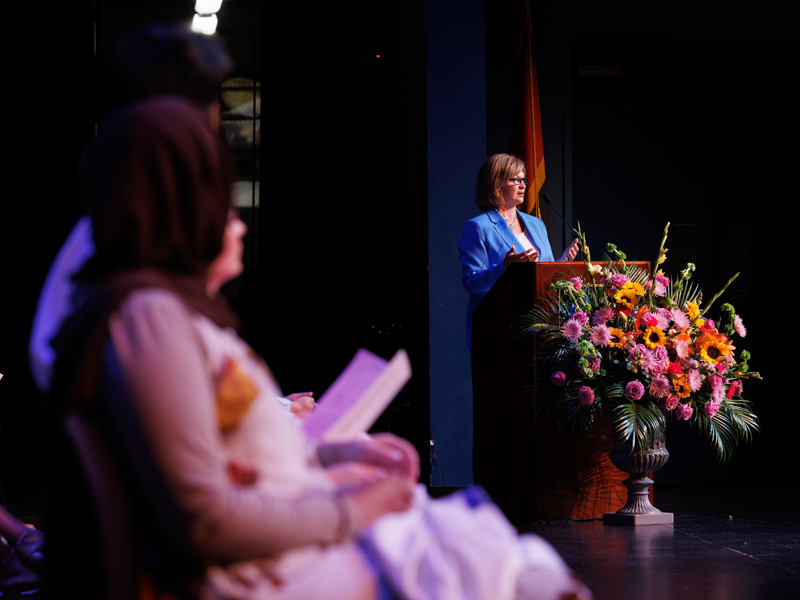 Dr. LouAnn Woodward describes to medical students the white coat's "special kind of magic" during the Class of 2028 White Coat Ceremony.