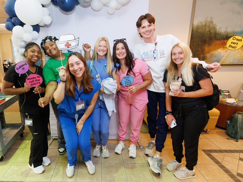 Nursing students, from left, Zy'Keria Cole, Makayla Bailey, Ashlee Ippolito, Camille Cottone, Mary Elizabeth Lewis, Brady Pinter and Corine Thier pose for photos following a back-to-school grab-and-go breakfast. Melanie Thortis/ UMMC Communications 