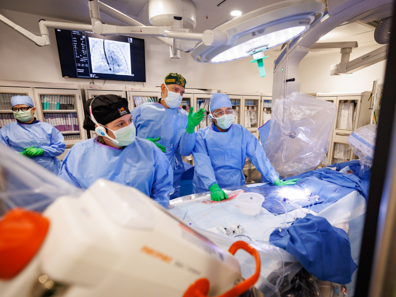 Dr. Makram Ebeid, professor and pediatric interventional cardiology specialist, is joined by co-operator, Dr. James Thompson, interventional cardiologist at Johns Hopkins All Children’s Hospital, in presenting a pediatric cardiac catheterization to the Pediatric and Congenital Interventional Cardiovascular Society Symposium.