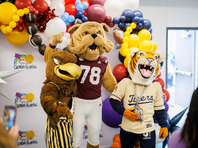 Seymour, Bully and Sonny Thee Tiger share their animal magnetism during a photo at Children's of Mississippi.