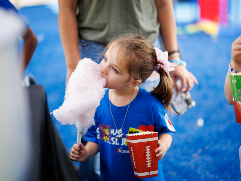 Ayla Ashley, 6, of Yazoo enjoying snacks during a Friends of Children's Hospital Tailgate Party.