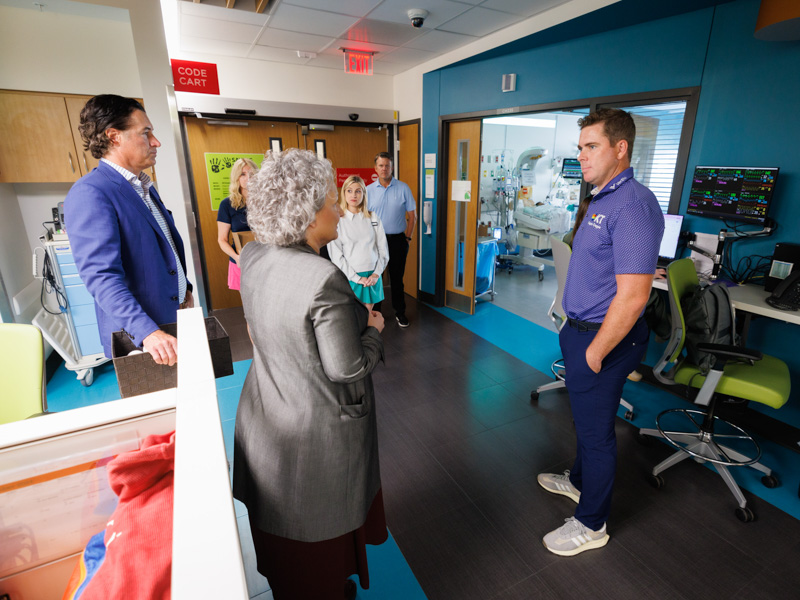 Luke List, right, winner of the 2023 Sanderson Farms Championship, visited the Kathy and Joe Sanderson Tower at Children's of Mississippi.