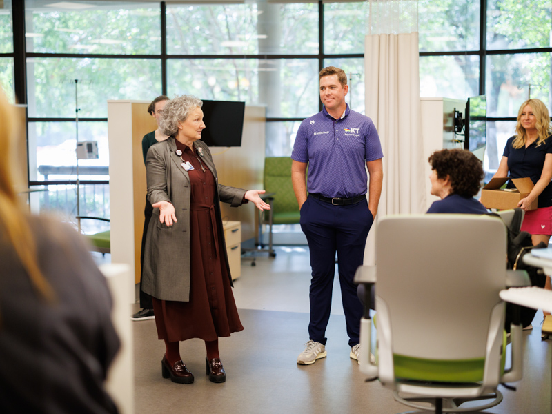 Ellen Hansen, left, Children's of Mississippi chief operations officer and chief nursing officer, gives 2023 Sanderson Farms Championship winner Luke List a tour of the children's hospital's newly renovated Center for Cancer and Blood Disorders.