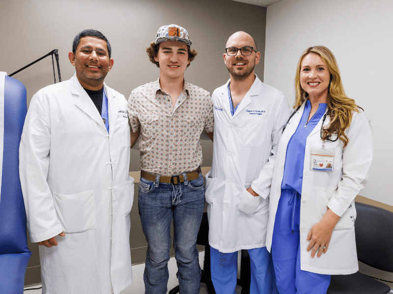 From left, Dr. Mrinal Shukla, professor of surgery and vascular surgeon; 16-year-old patient Charles "Tripp" Pender III of McCool; Dr. Clayton Rooks, surgery resident; and Melissa Culpepper, nurse practitioner.