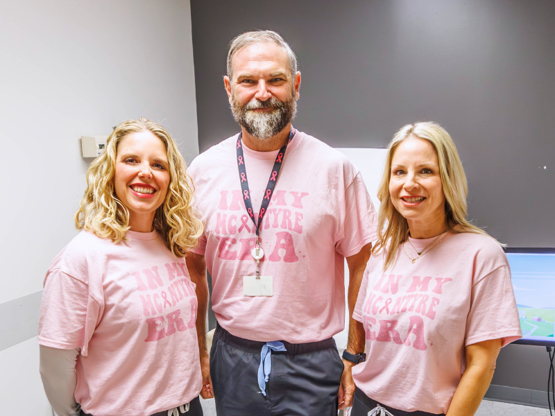 Dr. Benjamin McIntyre, professor of surgery and breast cancer reconstruction specialist, and his team members Sarah Gilbert, surgery care coordinator RN, left, and Michelle Henderson, nurse practitioner, sport matching pink T-shirts in support of breast cancer awareness month.