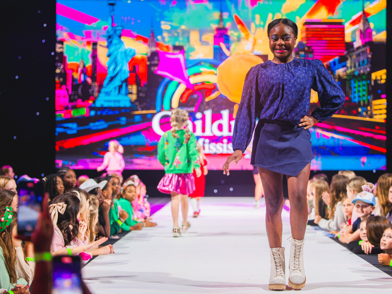 Nolee Jones, the state's 2022 Children's Miracle Network Hospitals Champion, models during the annual Tween Fashion Show at Mistletoe Marketplace.