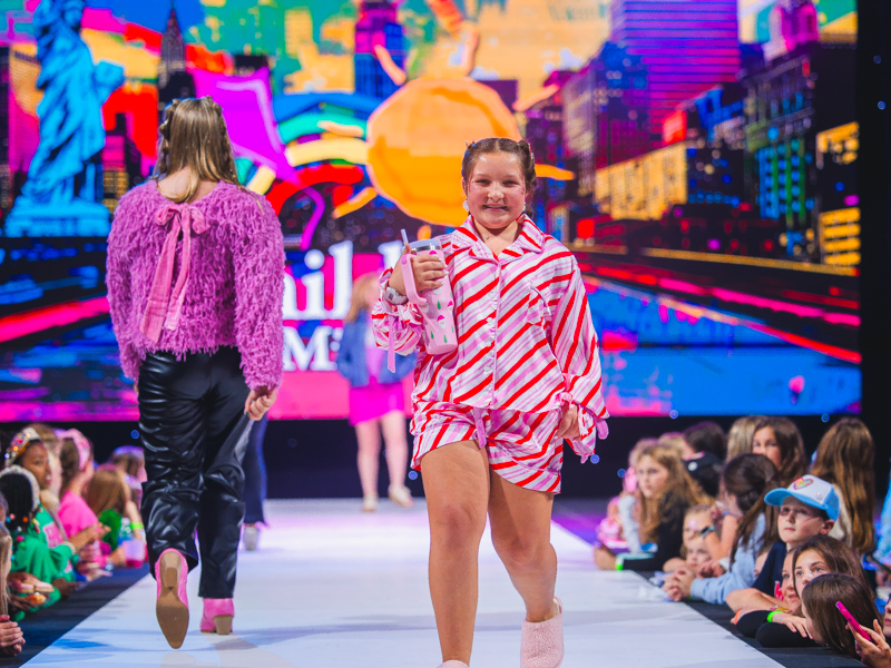 Children's of Mississippi patient June Goodson wears peppermint-striped loungewear at the annual Tween Fashion Show at Mistletoe Marketplace.