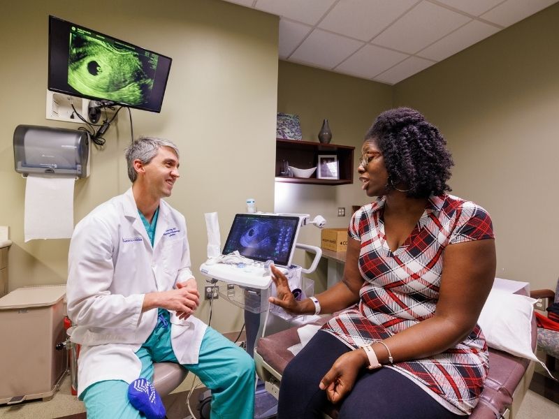 Marchelle Banks of Memphis consults with Dr. John Rushing, director of the IVF program in the UMMC Department of Obstetrics and Gynecology.