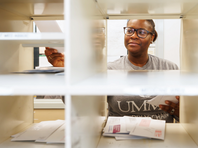 Nise Branson, a mail clerk at UMMC's post office, sorts mail for the Medical Center's many departments.