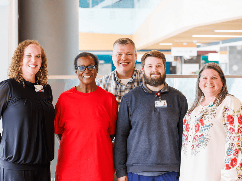 Among the team members who help patients and families get the care they need are, from left, Stacy Martin, associate director of ambulatory access; physician schedulers Eleanor Young, Jeremy Moore, Rhett Giordano and Kayla Taylor, associate director of ambulatory access management.