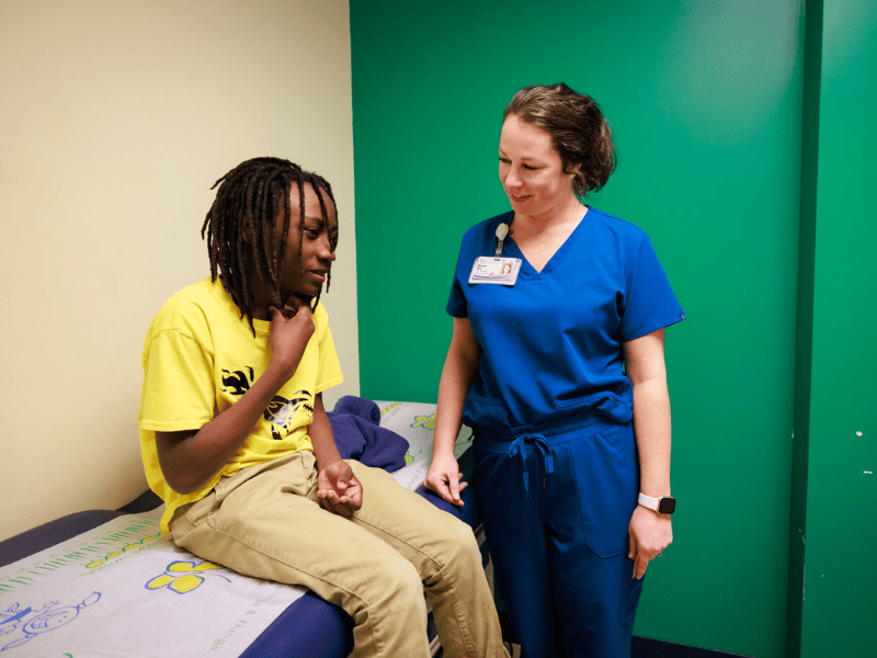 Jawun Bean of West Point talks with nurse practitioner Marguerite Baker during his endocrinology appointment at Children's of Mississippi's Tupelo Specialty Clinic.