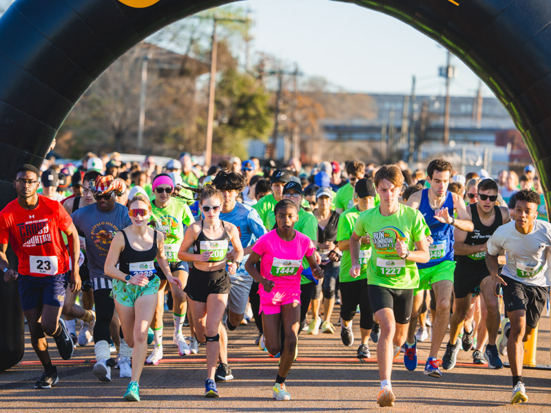 Runners are shown at the start of Run the Rainbow's 5K course.