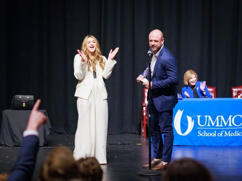 With wife, Bonnie, cheering him on, Chris Glasgow, president of the fourth-year medical school class, reveals that he has matched in anesthesiology at UMMC.