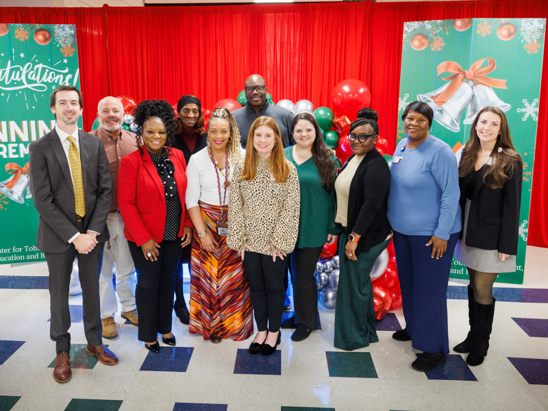 The ACT Center team poses for a photo, from left, [front row] Dr. Jonathan Hontzas, director; Sharon Terry, tobacco treatment specialist; Kelli Grant-Olive, manager of research operations; Brittany Tichenor, tobacco treatment specialist; Erica Cameron, lung cancer screening coordinator; Latoya Scott, scheduler; Stacy Wilson, medical office assistant; Leslie Musshafen, associate director of administration for the Cancer Center & Research Institute; [back row] Langston Moore, project manager for the Cancer Center & Research Institute; Kathy Banks, administrative assistant; and Robert Lock, tobacco treatment specialist.