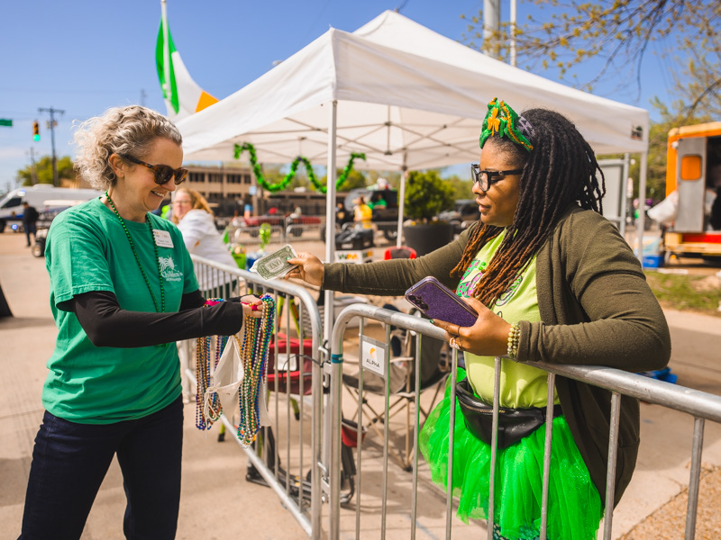 Frances Croft, manager-community and annual giving at UMMC, collects a donation from Samanda Summers at City Sweep benefitting the children's hospital. Lindsay McMurtray/ UMMC Communications