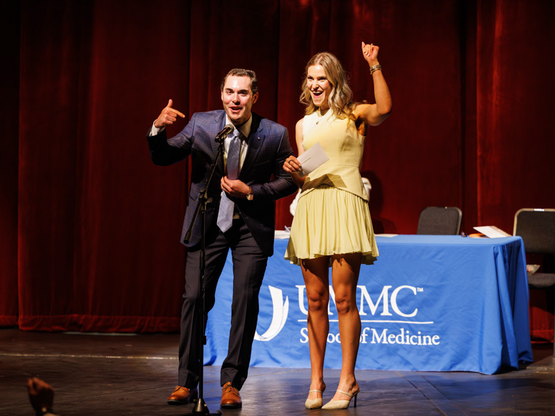 Reid Fracchia and Kate Purdom announce their match in urology and internal medicine at UMMC during School of Medicine Match Day ceremony.