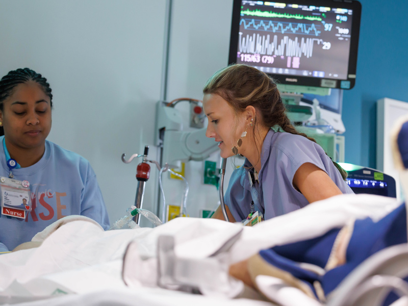 Registered Nurses Tiana Williams and Alexis Gaines take care of a patient in the PICU. The PICU has been awarded the Pediatric Nurse Excellence Diamond Award, the highest distinction presented by the Society of Pediatric Nurses.