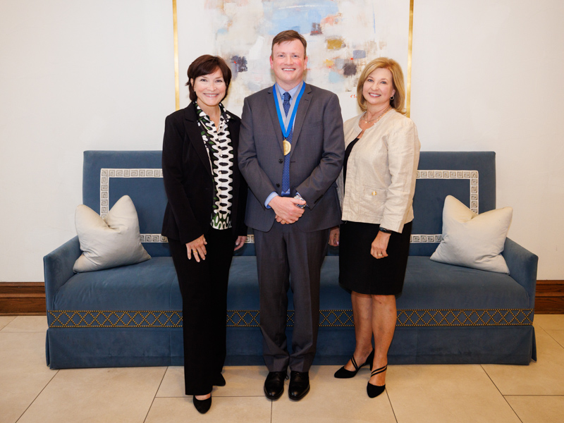 Dr. Mary Taylor, Suzan B. Thames Chair and CEO of Children’s of Mississippi; Dr. Brad Ingram, McCarty Chair of Neurology; and Dr. LouAnn Woodward, vice chancellor for health affairs, pose together at the naming celebration for Ingram.
