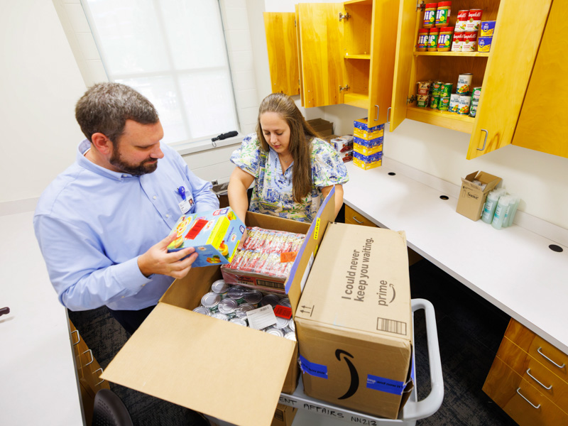 Director of Student Services Jonathan Nutt and senior administrative assistant Anna Vancor unload boxes into the Student Food Pantry. An amazon wishlist was made available to employees or students that wish to donate.