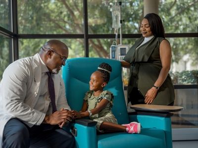 Caring for Mississippi’s youngest patients is part of the mission for Dr. Dereck Davis, with patient Asia Sherron and her aunt at Children’s of Mississippi.
