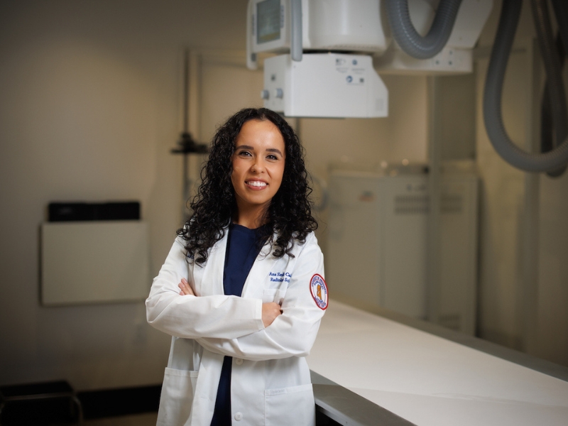 Emilia Calderon, a senior radiologic sciences student at the University of Mississippi Medical Center, wears her white coat as she prepares for a career in medical imaging, where she hopes to play a vital role in patient care through the detection and diagnosis of diseases, including cancer.