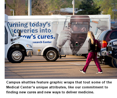 UMMC Bus displaying Male African-American Student