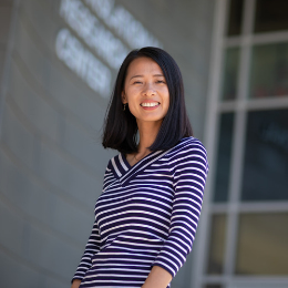Female data science student poses in front of Translational Research Center