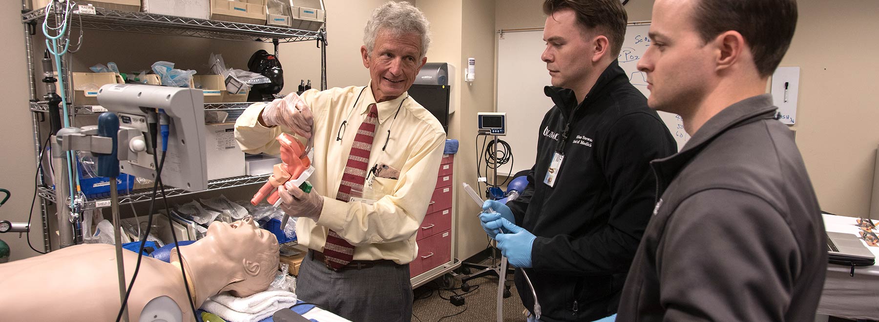 A UMMC faculty member demonstrates an anesthesia technique for students