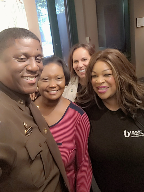 Citizens Academy group picture of four attendees