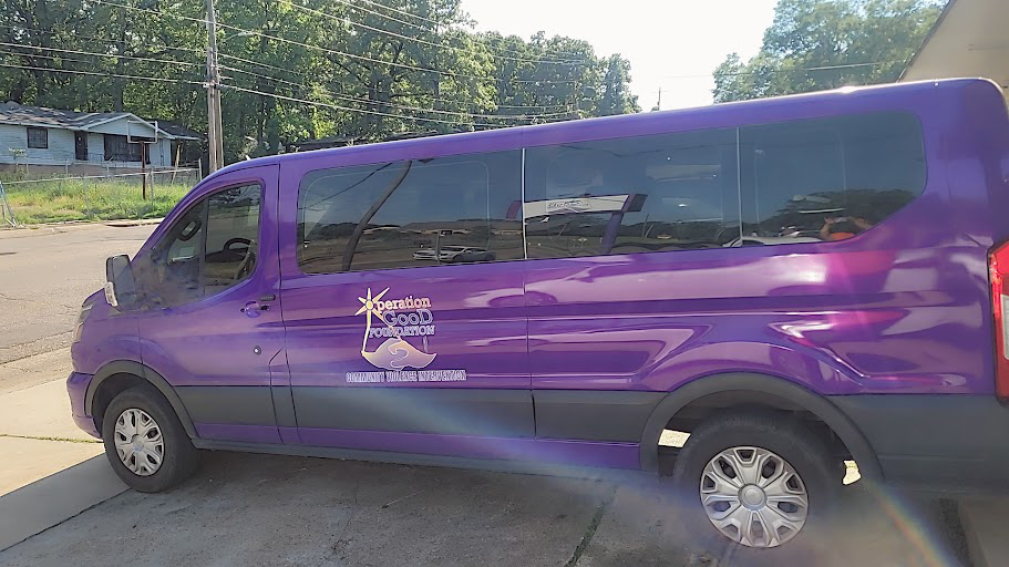 Sideview of the purple Operation Good Foundation van.