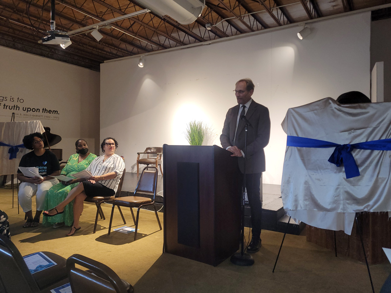 Rev. Dr. Allen addresses the crowd before the center sign is revealed.